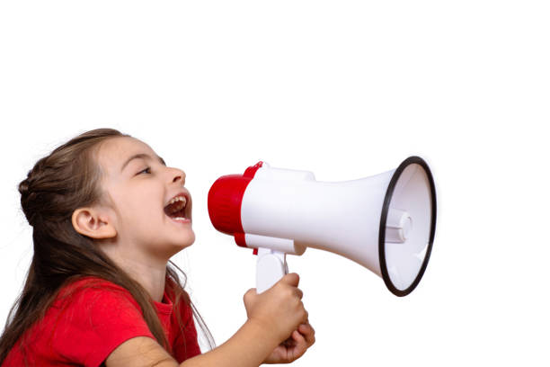 istock Little girl screaming on a megaphone. 1129258967