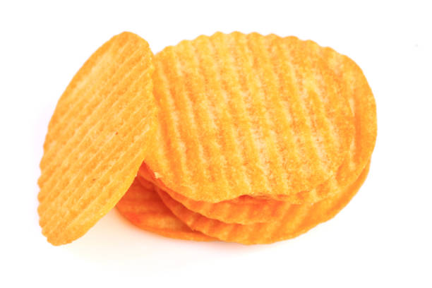 istock Pile of potato chips isolated on white background 1129259688