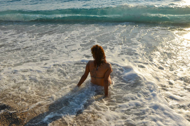 istock Happy woman having fun at sea. 1129261802