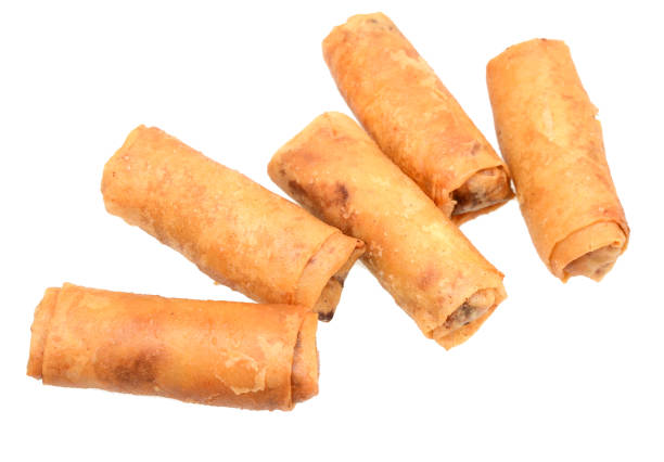 istock A eating of fried egg rolls food 1129262488