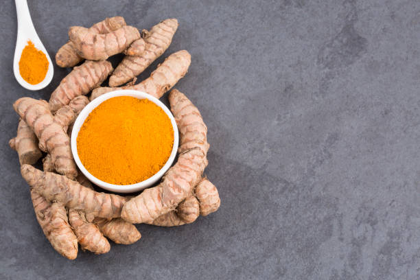 istock Roots and organic turmeric powder - Curcuma longa 1129268328