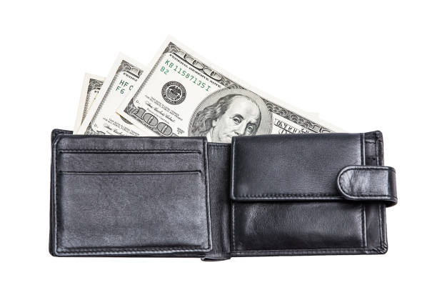 istock Black wallet with dollars deployed horizontally on a white background isolated. 1129270268