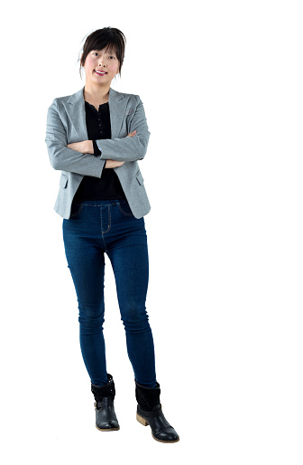 Businesswoman with arms crossed on white background.