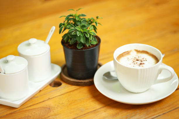istock Cup of coffee on the wooden table. 1129276823