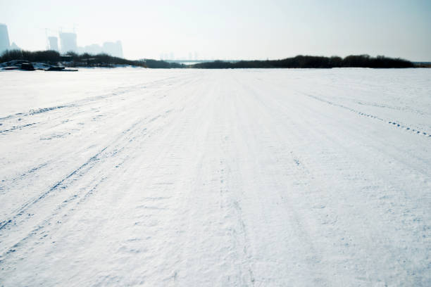 istock Tire track in the snow 1129280006