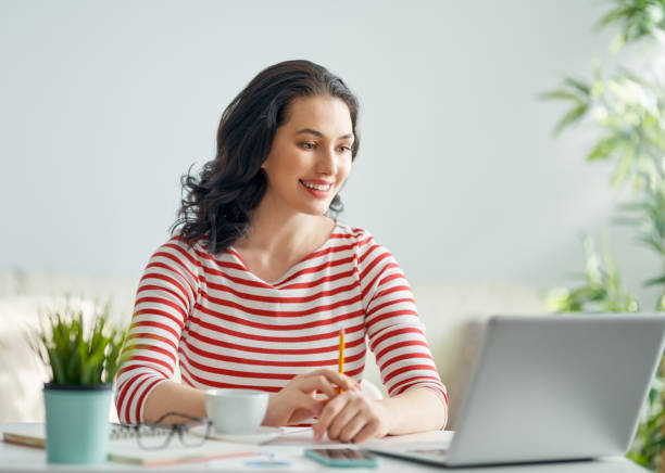istock woman working on a laptop 1129283131