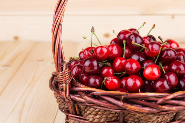 istock Fresh cherries in a wicker basket. 1129288293