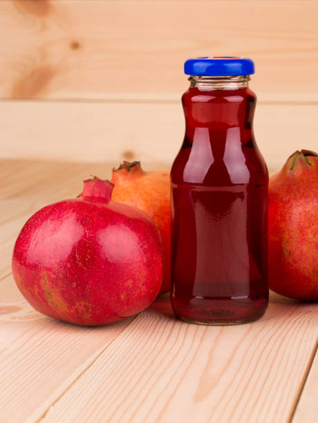 istock Bottle of pomegranate juice and pomegranates. 1129288361