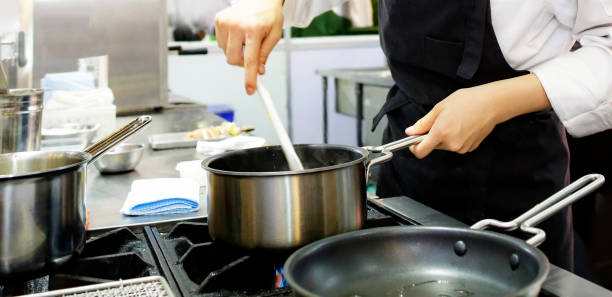 istock Chef preparing food, meal, in the kitchen, chef cooking, Chef decorating dish 1129288724