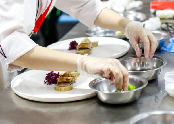 istock Chef cooking food in the kitchen, Chef preparing food 1129288739