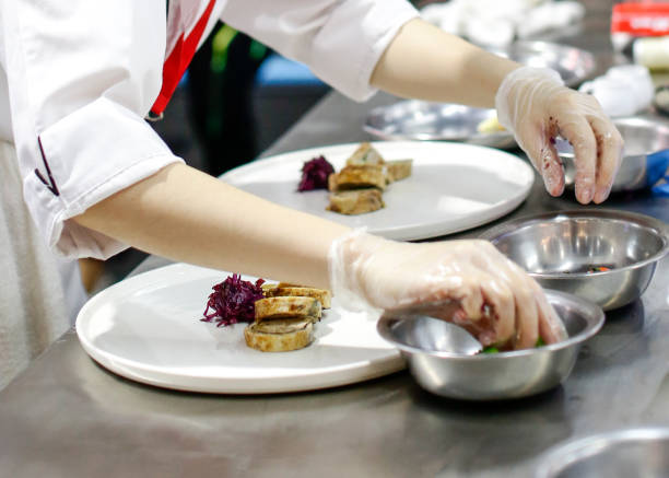 istock Chef cooking food in the kitchen, Chef preparing food 1129288747