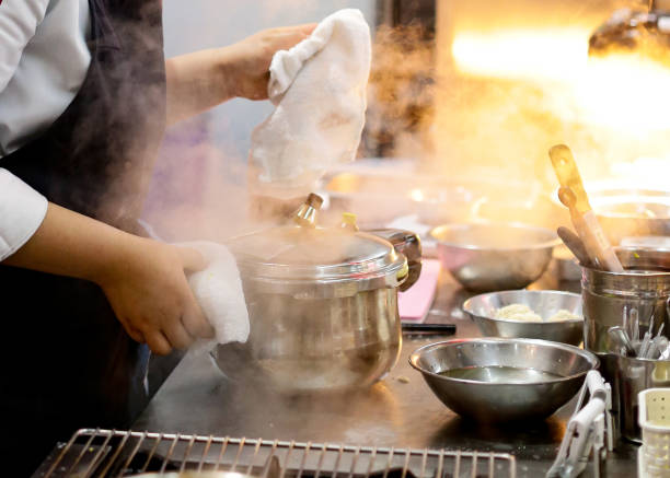 istock Chef preparing food, meal, in the kitchen, chef cooking, Chef decorating dish 1129288758
