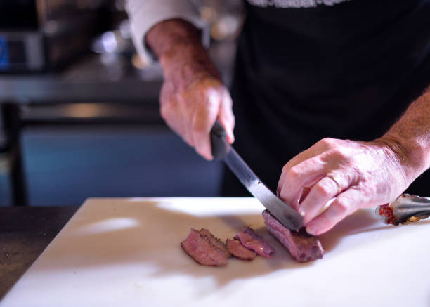 istock Chef preparing food, meal, in the kitchen, chef cooking, Chef decorating dish 1129288774