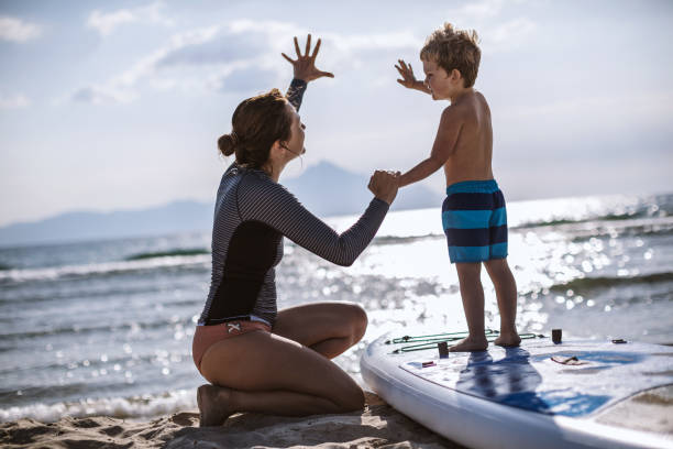 istock Mother and son on a paddle board 1129289250