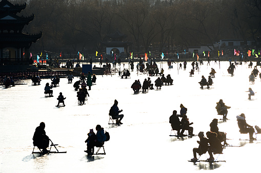 The silhouette of Chinese people enjoy ice-skating