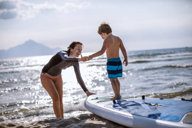 istock Surfing Lessons for my little one 1129289983