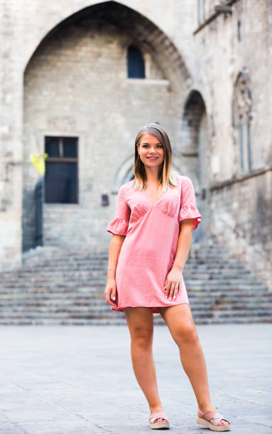 istock Woman strolling at old town streets 1129290013