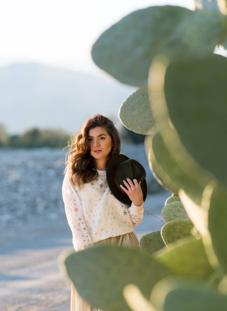 istock Fashion model posing outdoors 1129292992