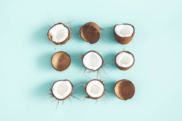 istock Summer composition. Coconut pattern on pastel blue background. Summer concept. Flat lay, top view 1129301840