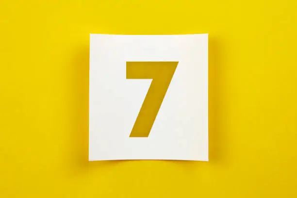 Photo of Note paper with number seven on it.