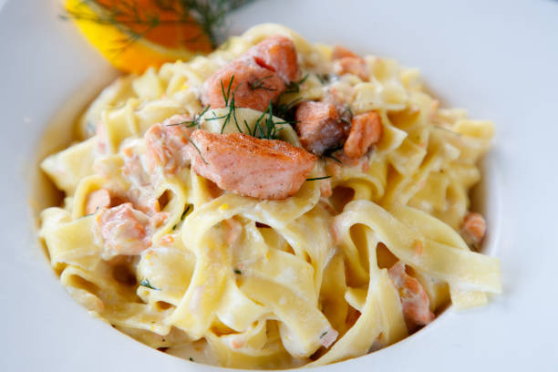 istock Tagliatelle in cream sauce with salmon 1129305418