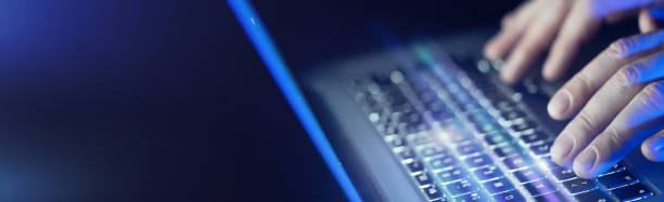 istock Close-up of male hands and laptop 1129306849