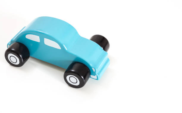 istock A blue toy car, on white background with copy-space. 1129308643