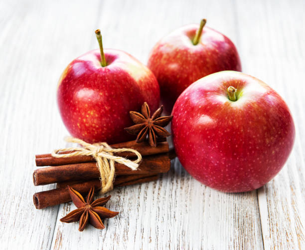 istock Red apples with cinnamon sticks and anise 1129309010