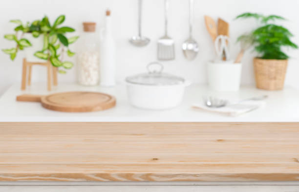 istock Wooden table top on blurred kitchen counter background 1129310156