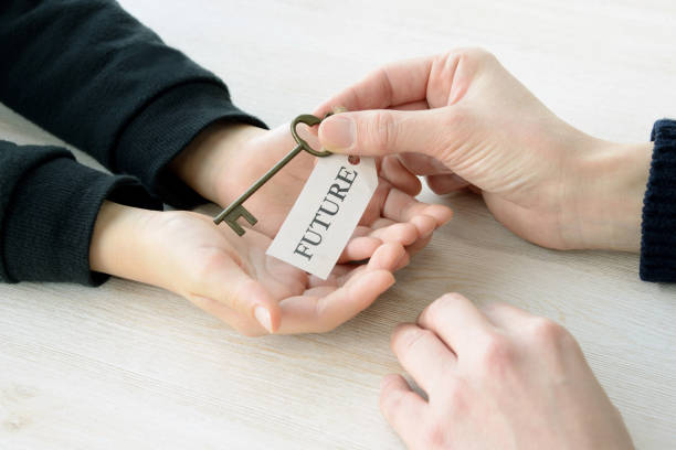 istock Key with future tag given from parent to child 1129310435