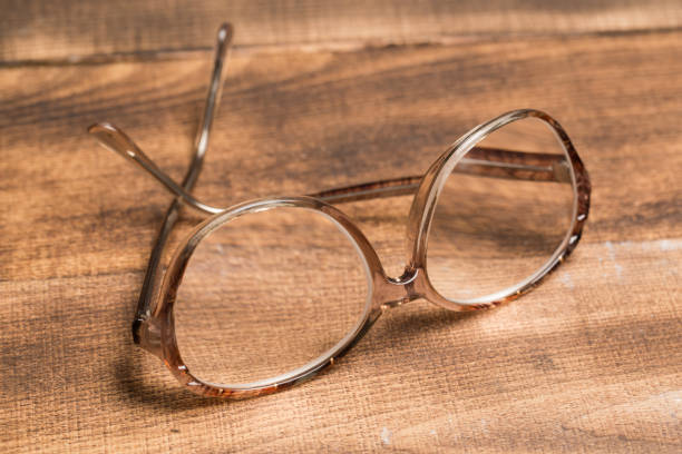 istock A pair of glasses on a wooden table 1129311447