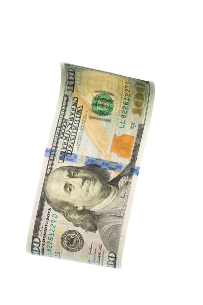 istock flying banknote of hundred dollars isolated on white 1129312107