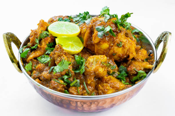 Indian chicken curry with Indian spices Indian chicken curry close up view, hot delicious indian homemade chicken served in authentic copper bowl. karahi stock pictures, royalty-free photos & images