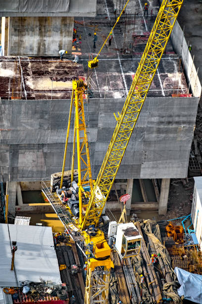 istock Aerial view of a building construction in progress 1129316991