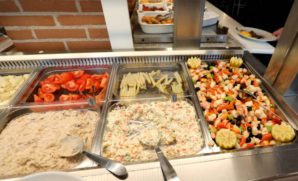 istock self service restaurant with Olivier food and fish salad 1129317455