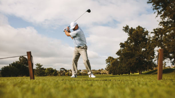 istock Senior male golfer taking shot 1129317730