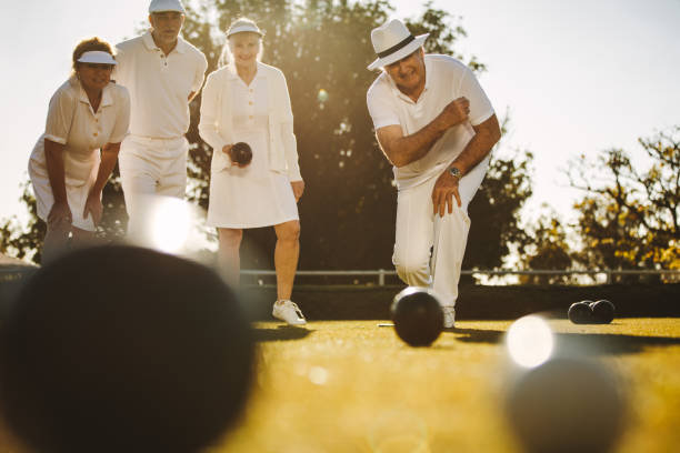 istock Senior people playing boules in a park 1129319563