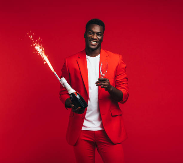 istock Stylish man celebrating new years eve 1129319990