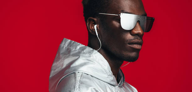 istock Young guy styled in futuristic outfit 1129320542