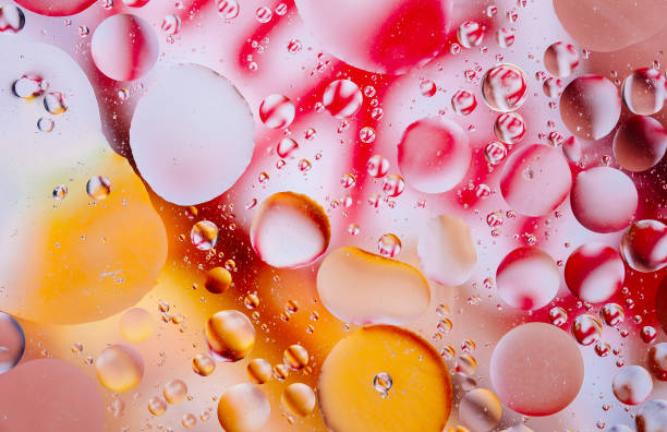 istock Water oil bubble macro abstract background flow liquid red orange yellow colors 1129320669