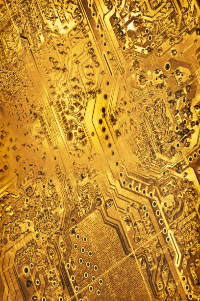 istock Circuit Board Detail Gold Colored Monochrome Yellow Vignette Background 1129321321