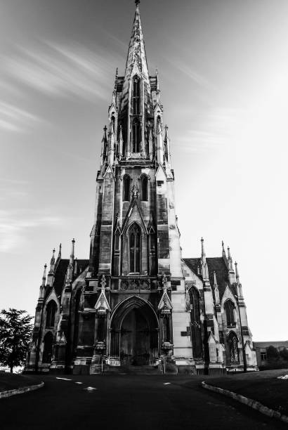 Old medieval stone church for Christians Catholics to come and pray Old church in the city for people to come and visit and to pray and worship anglican eucharist stock pictures, royalty-free photos & images