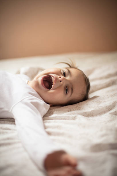 istock Enjoys the comfort of the bed. 1129323643