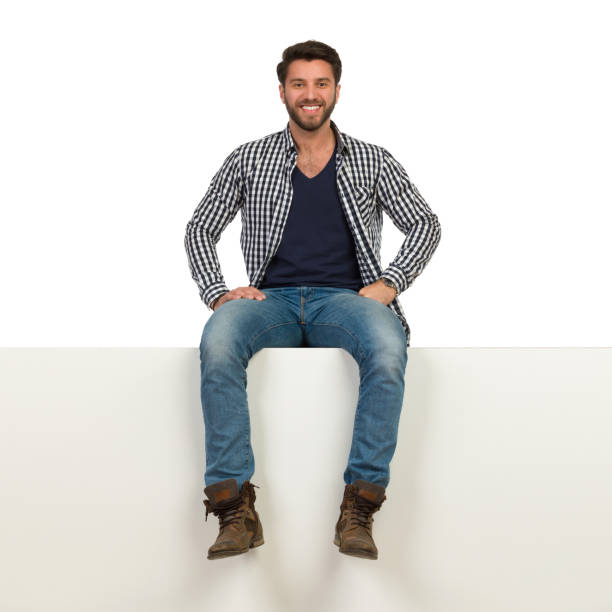 istock Happy Hendsome Man Is Sitting On A Top 1129325649