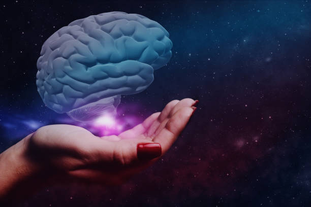 istock Woman holding brain in palm. Mixed media. 1129327979
