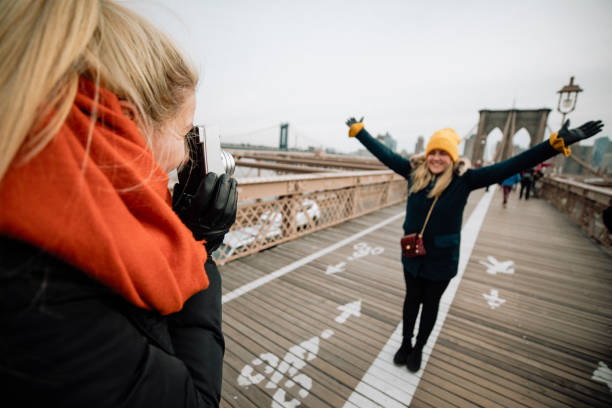 istock Posing for a Photo on Brooklyn Bridge 1129329384