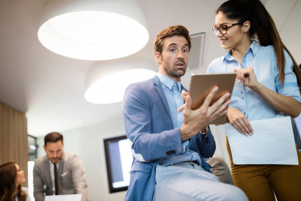 istock Successful business group of people at work in office 1129331114