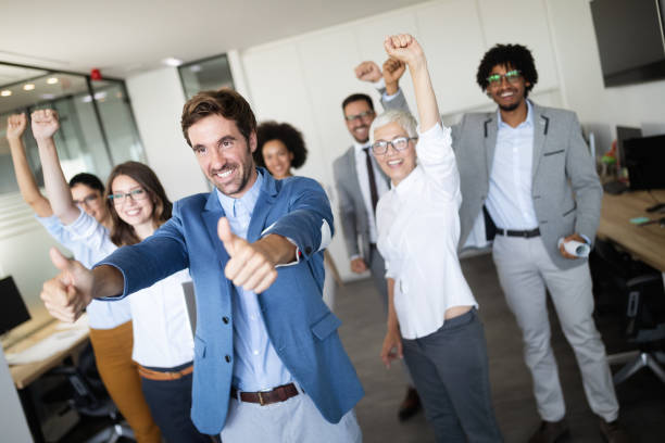 istock Successful business group of people at work in office 1129331136