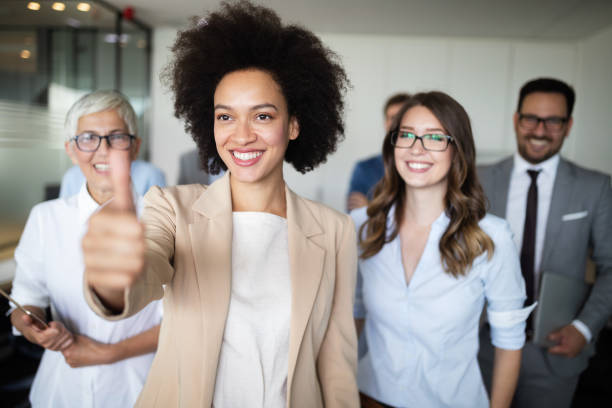 istock Group of successful business people in office 1129331145