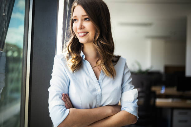 istock Successful business woman looking confident and smiling 1129331257